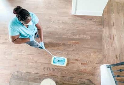 Team Member Sweeping Floor