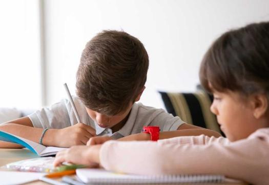 Kids completing schoolwork | Merry Maids