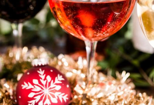 Wine glass in front of a Christmas tree |Merry Maids